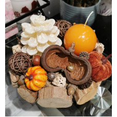 Autumn candle with pumpkin