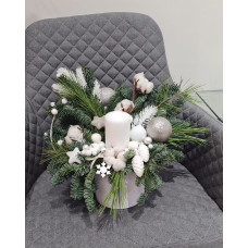 Christmas composition in a pot with one white candle in white tones